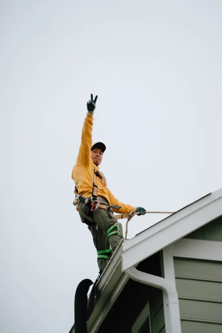 man standing on top of the roof